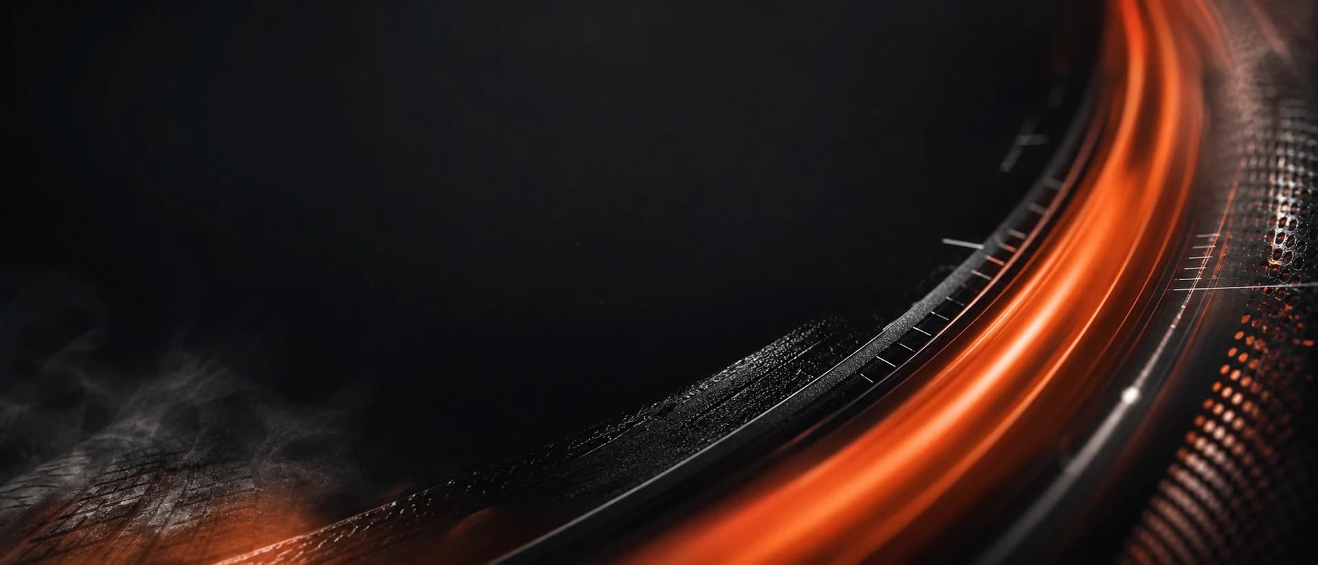Abstract orange velocity arc over machined black automotive materials