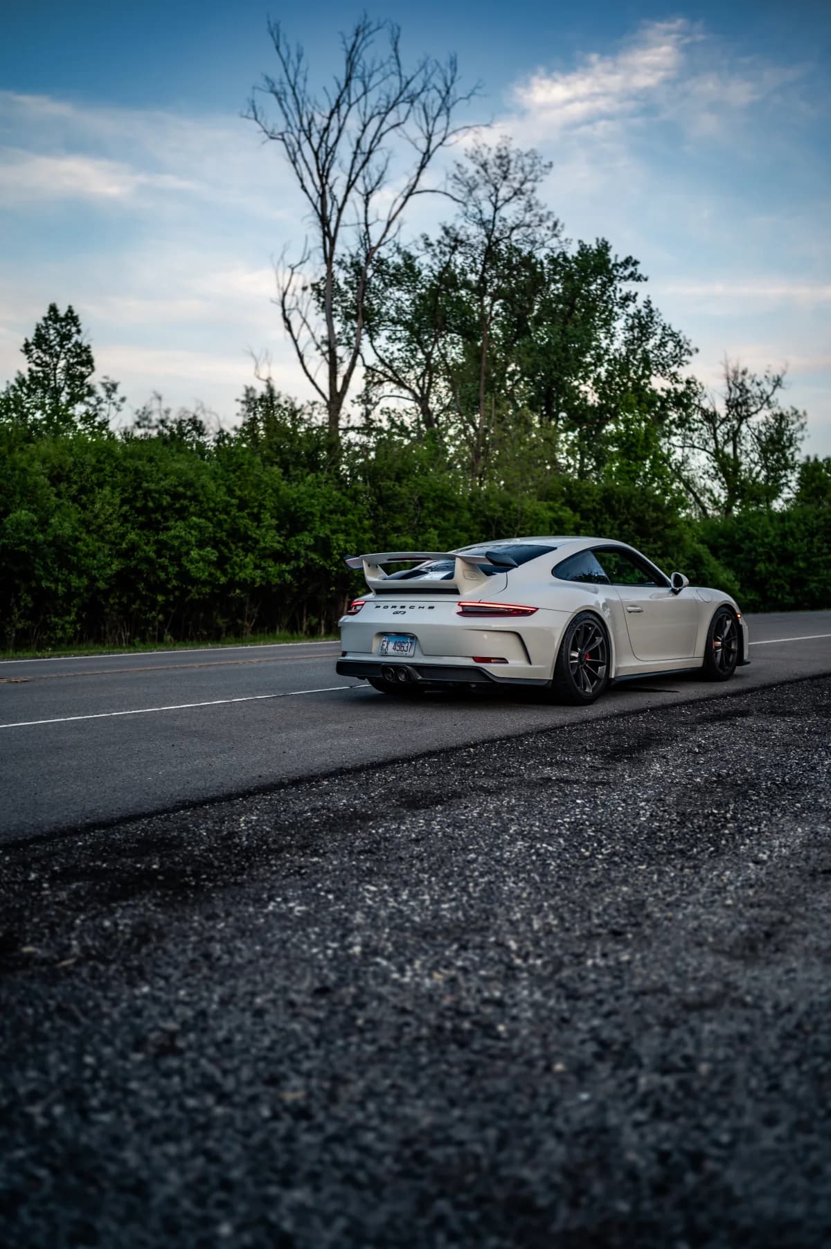 White Porsche 911 GT3 (991.2) in a rear three-quarter view