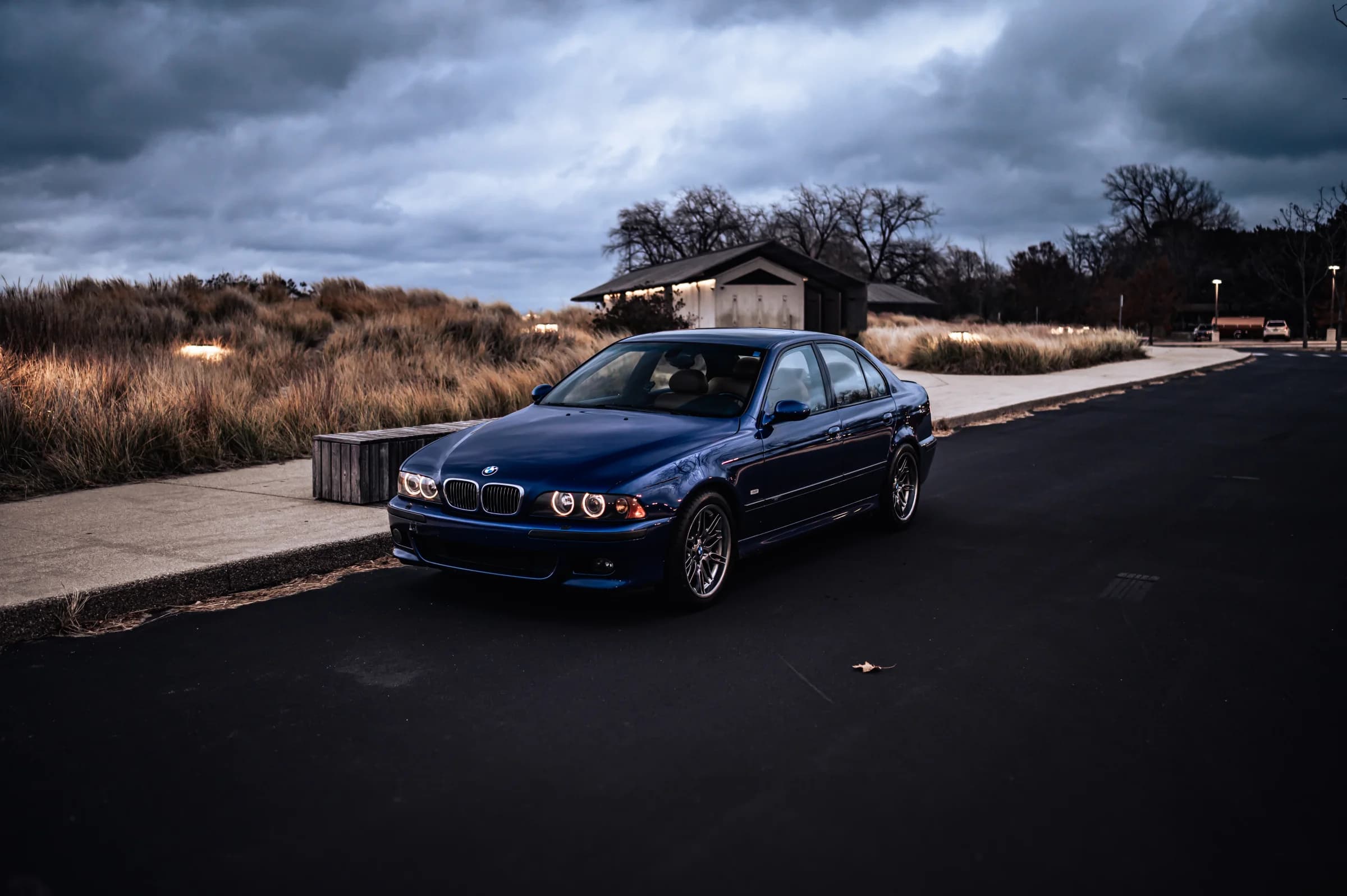 Blue BMW E39 M5 photographed beneath a dramatic November sky
